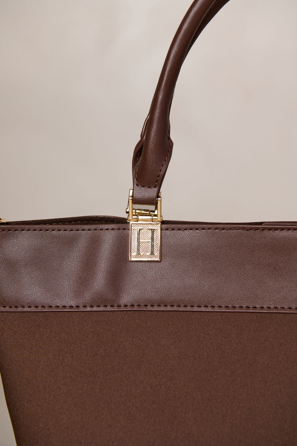 Chocolate brown bag with gold hardware