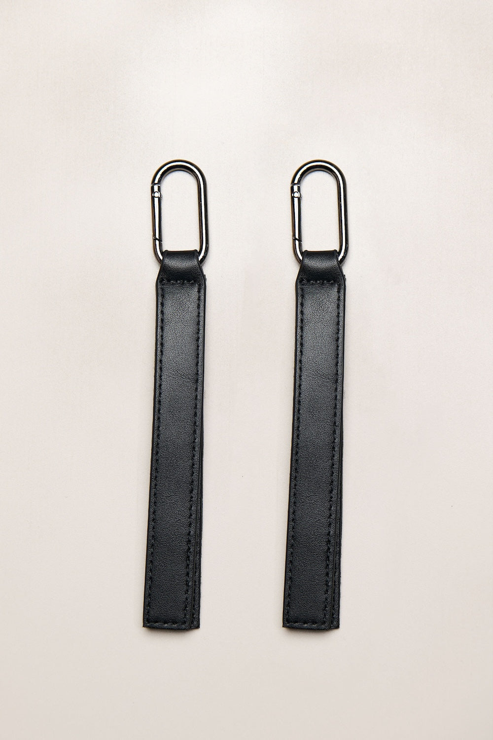 Black Heiych H-Pram Straps for attaching bags to a pram