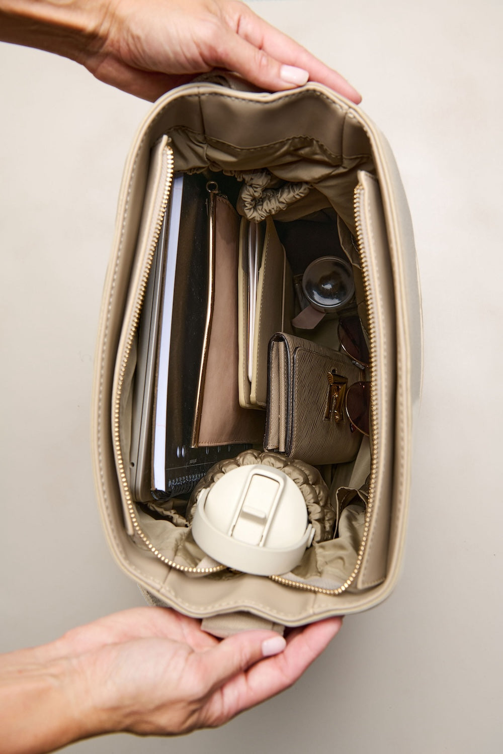Taupe cream bag with laptop inside