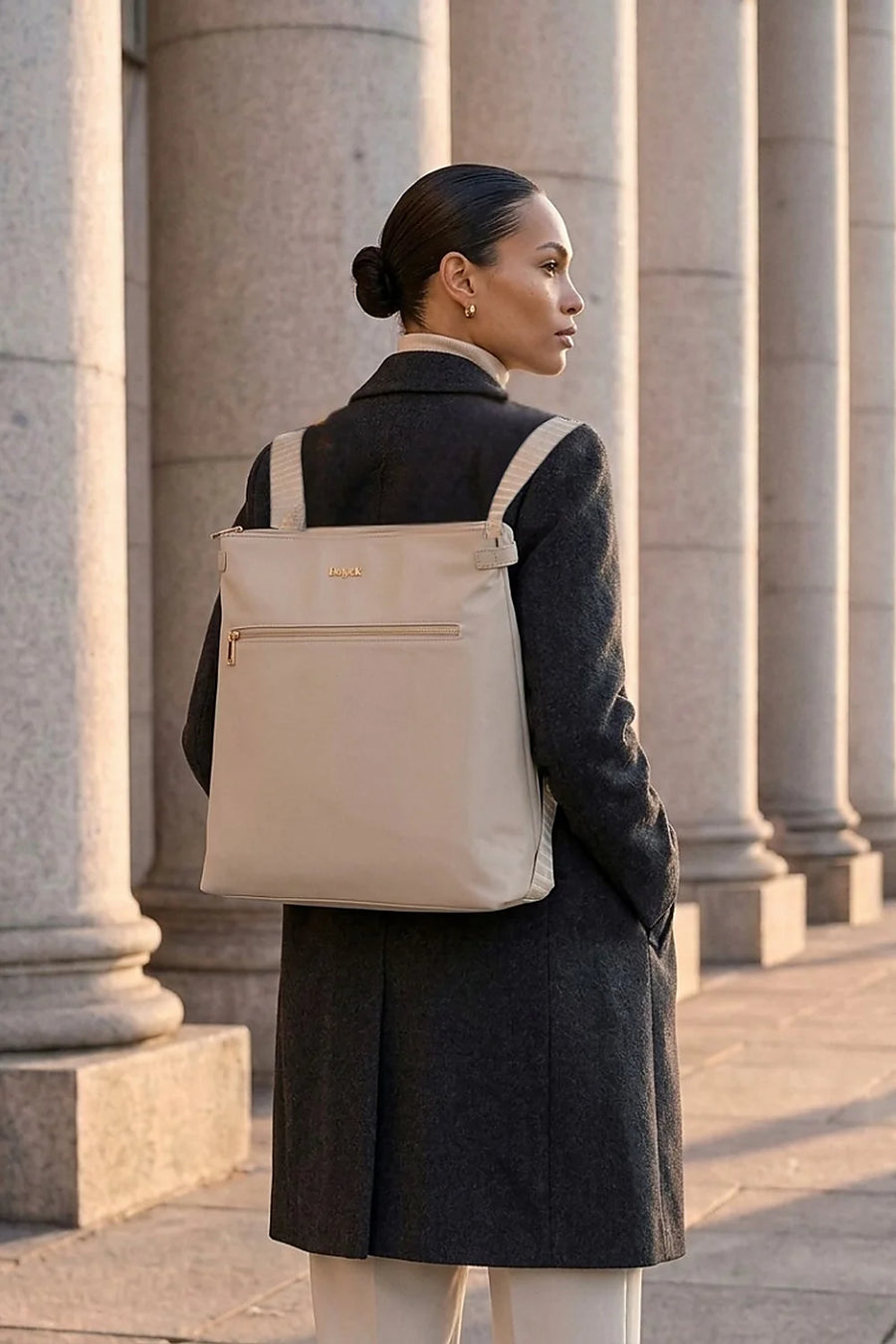 Taupe H-Convert worn as a backpack