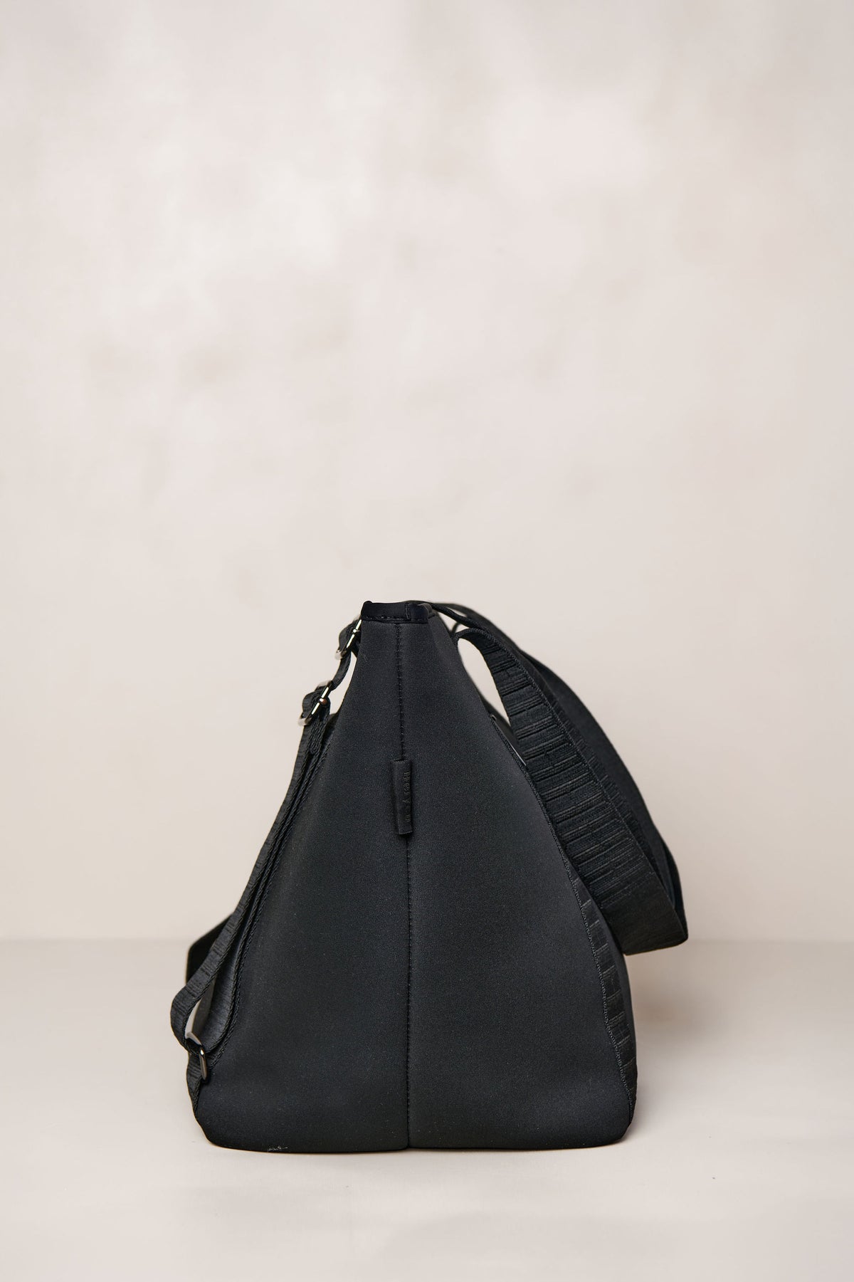 Black carry all womens convertible tote backpack bag in neoprene XL with adjustable straps side
