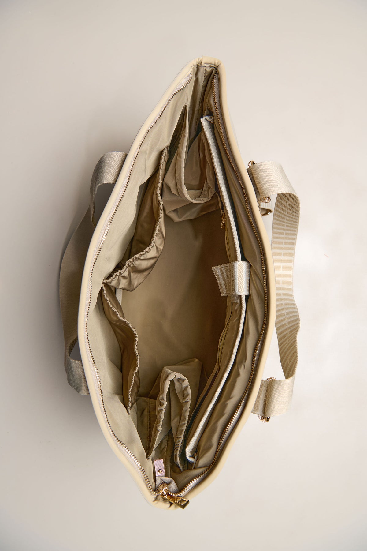 Taupe inside pockets of carry all bag